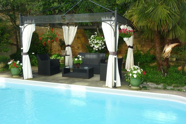 Seasonal outdoor pool, open 10:00 AM to 8:30 PM, pool umbrellas