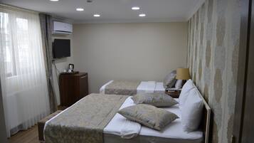 Deluxe Triple Room, City View | Iron/ironing board, rollaway beds, free WiFi