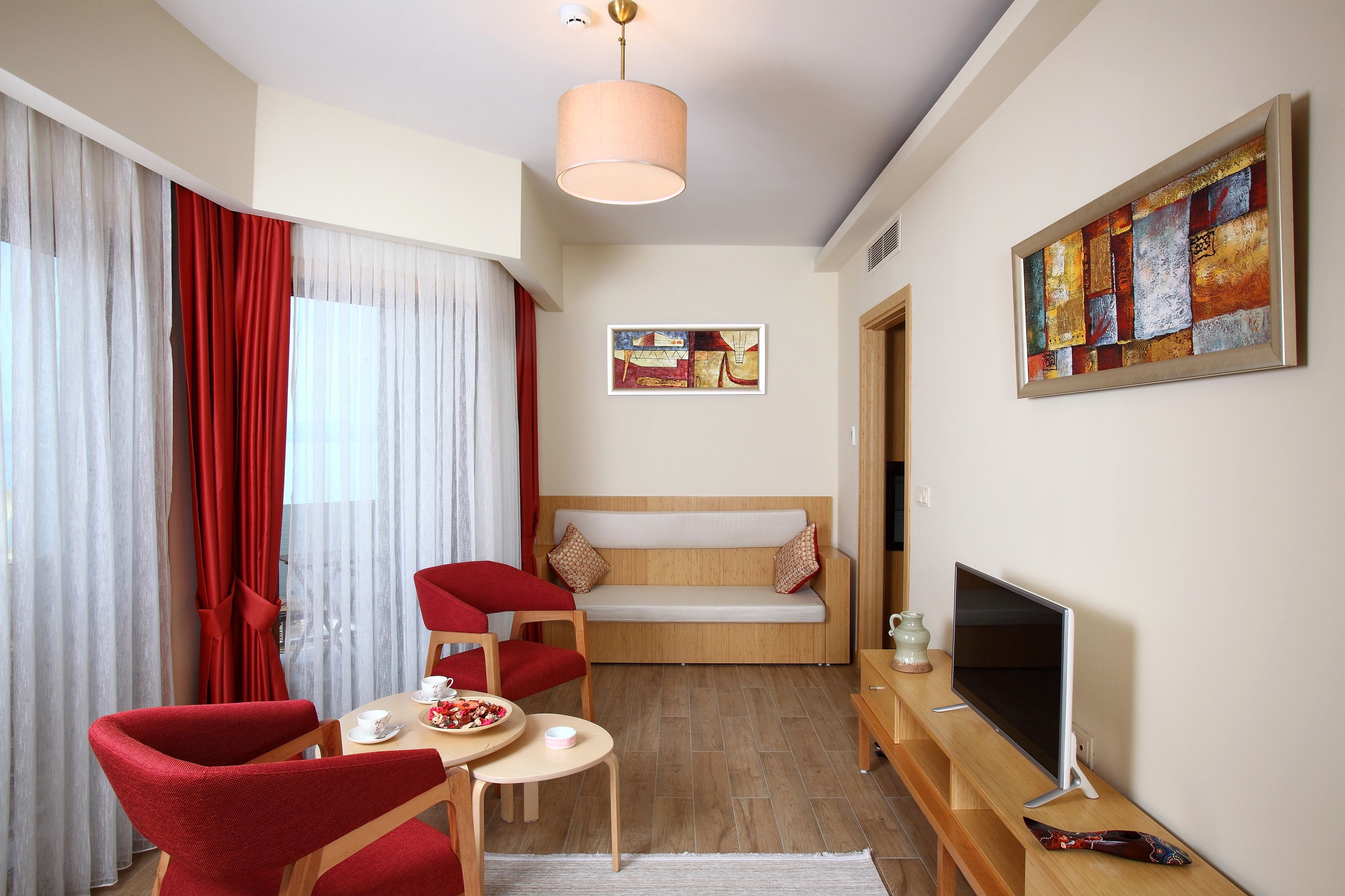 family suite, 2 bedrooms, courtyard view | living area | lcd tv