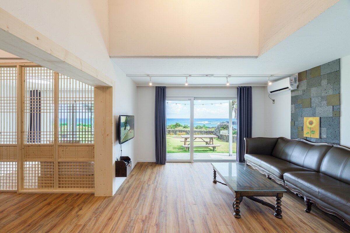 Luxury Quadruple Room, Patio, Sea View | Living area | 40-inch flat-screen TV with cable channels, TV, heated floors