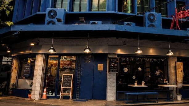 A building with a sign reading 'LOFTEL STATION' indicating it is a hostel, cafe, and event venue. - Loftel Station Hostel (Bangkok)