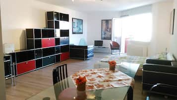 Studio, 1 Bedroom, Park View | Living area | 28-inch TV with cable channels