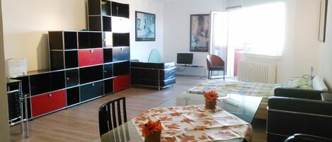 Studio, 1 Bedroom, Park View | Living area | 28-inch TV with cable channels