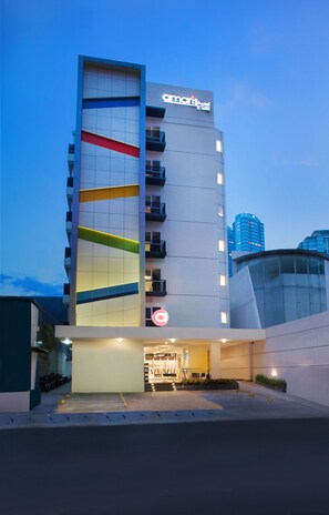 A modern hotel with a prominent 'amaris Hotel' sign, a multi-story structure with balconies, and a well-lit entrance. - Amaris Hotel Satrio Kuningan - Jakarta (Jakarta)
