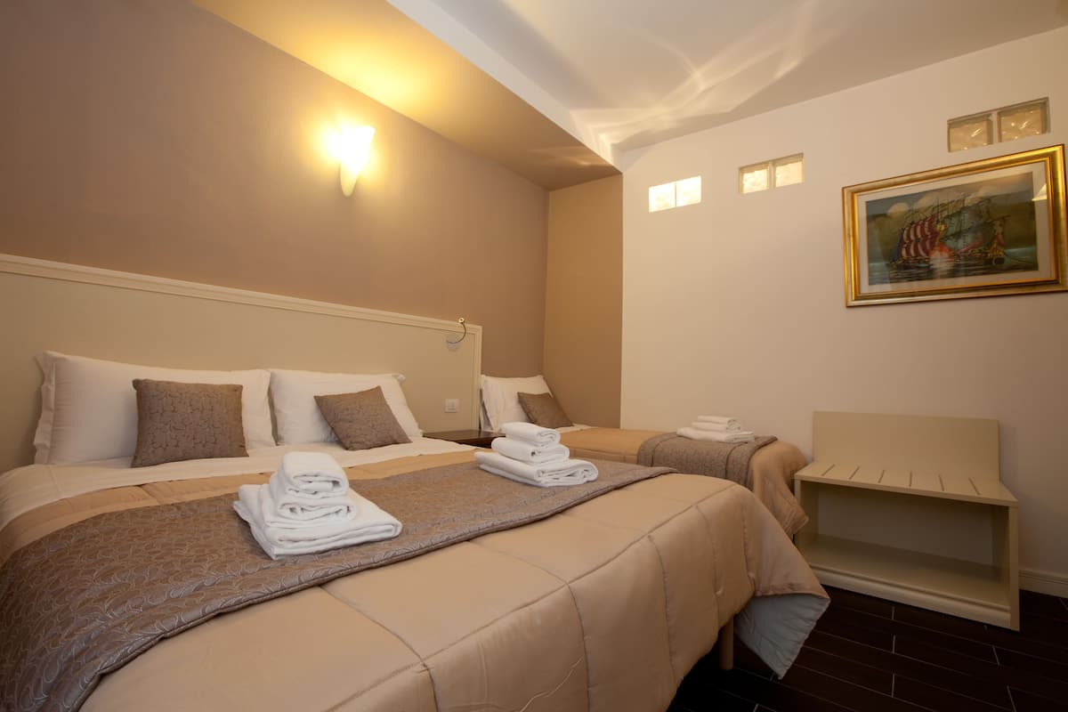 Family Triple Room, Multiple Bedrooms | Premium bedding, minibar, in-room safe, desk
