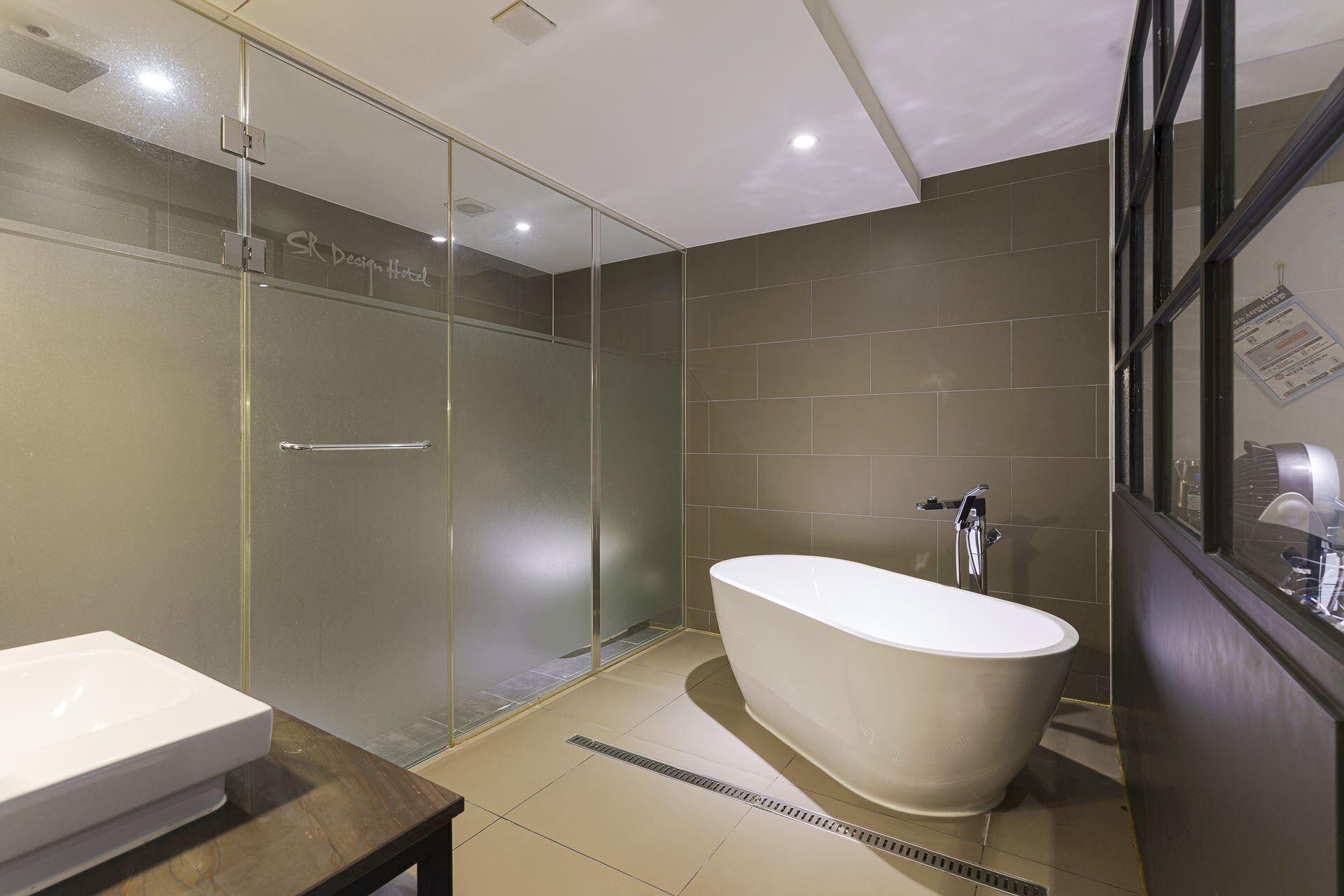 premium room | bathroom | hair dryer, slippers, bidet, towels