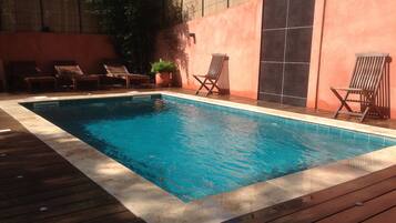 Seasonal outdoor pool, open 9:00 AM to 10:00 PM, sun loungers