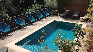 Seasonal outdoor pool, open 9:00 AM to 10:00 PM, sun loungers