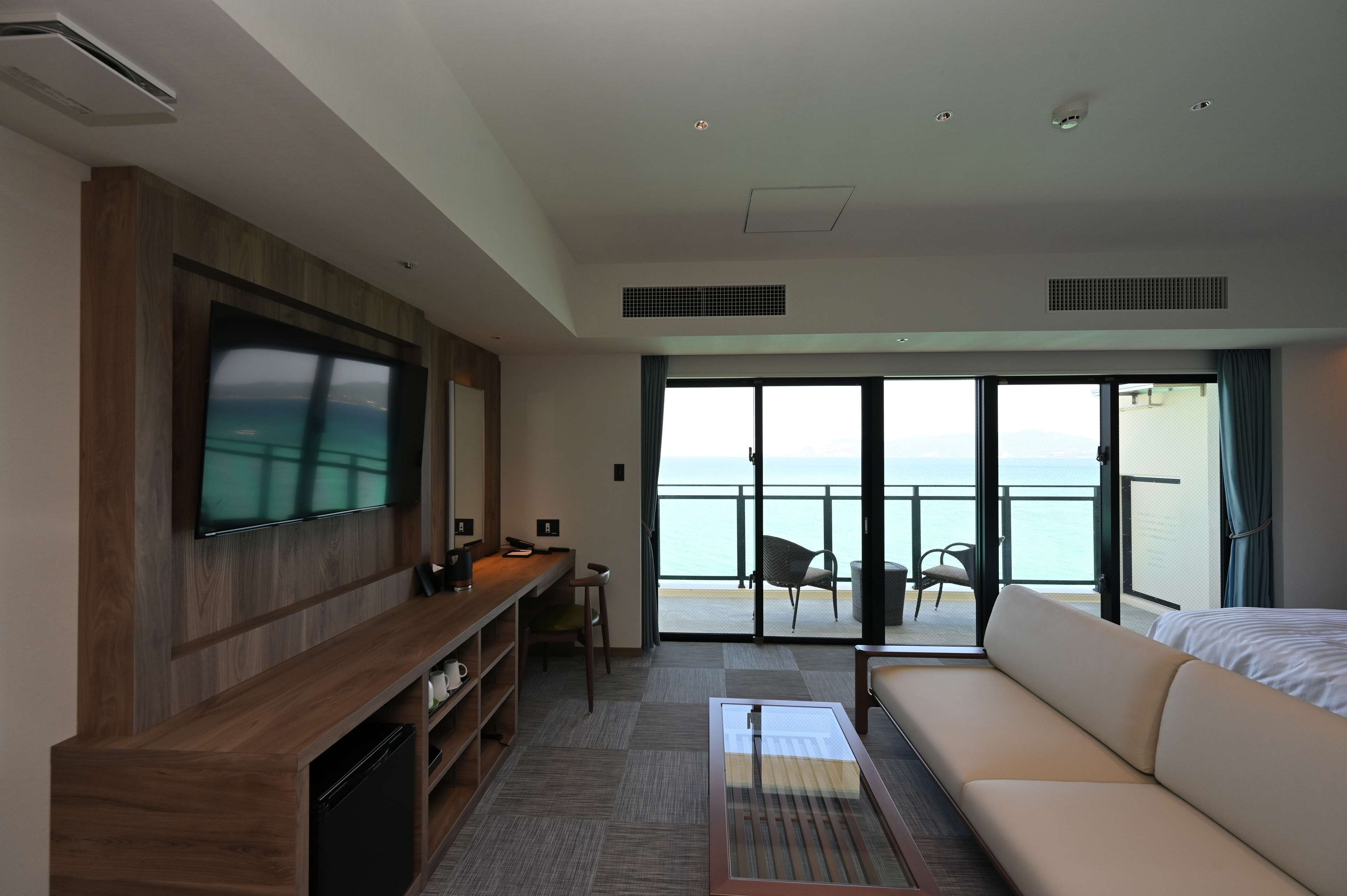 premium room, 2 single beds, balcony, oceanfront | 1 bedroom, in-room safe, desk, iron/ironing board