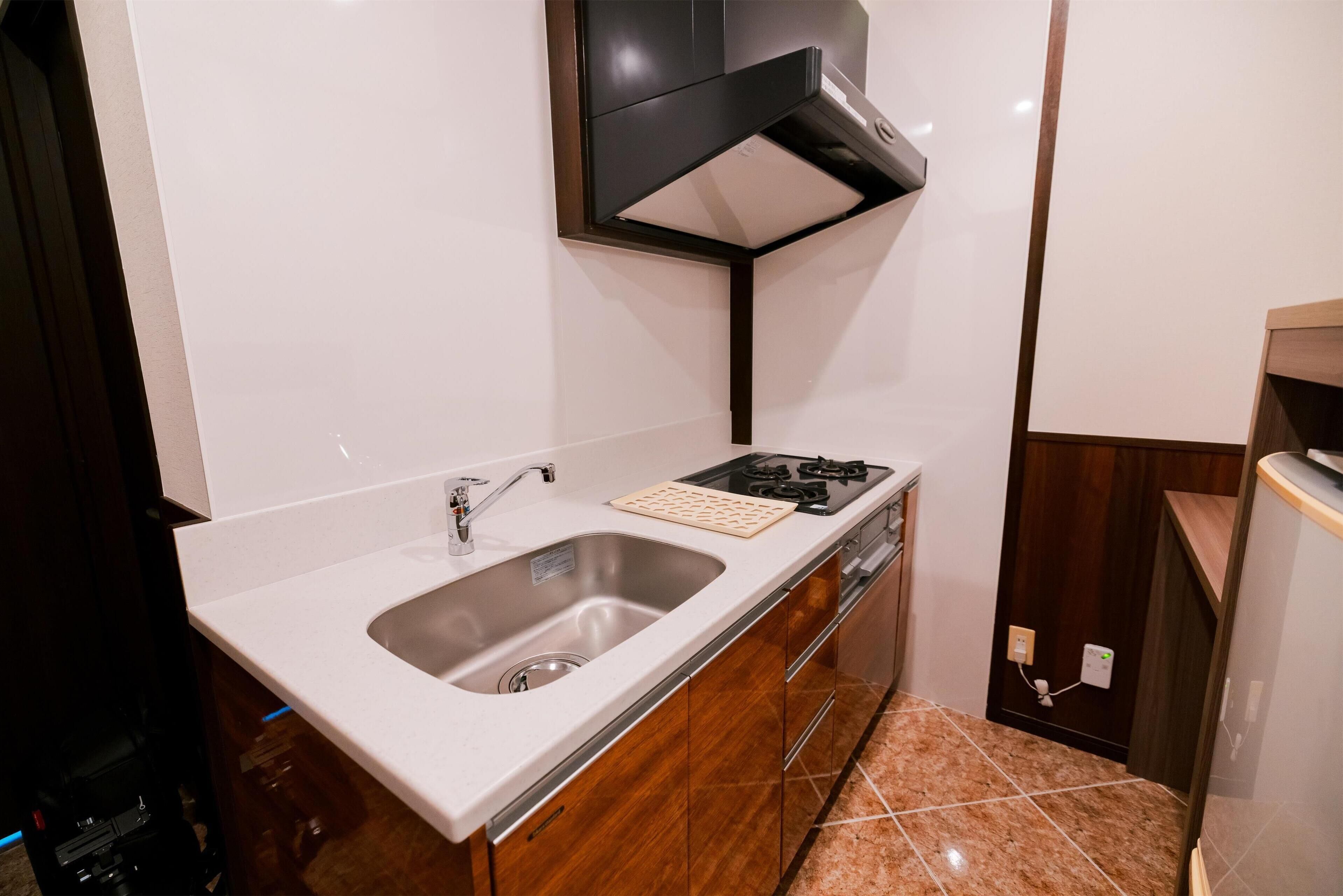 deluxe room, multiple beds, non smoking, oceanfront | private kitchenette | fridge, electric kettle