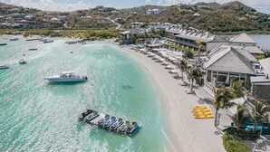A coastal resort with a beach, boats, and villas. - Le Barthélemy Hotel & Spa (St. Barthelemy)