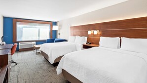 A hotel room with two beds, a desk, a chair, and a window with blinds. - Holiday Inn Express & Suites Detroit Northwest - Livonia by IHG (Livonia)