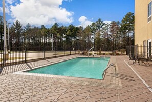 Outdoor pool, open 9:00 AM to 9:00 PM, pool umbrellas, pool loungers