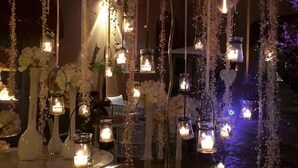A decorative outdoor setting with hanging lanterns and floral arrangements. - San Leucio Resort (Caserta)