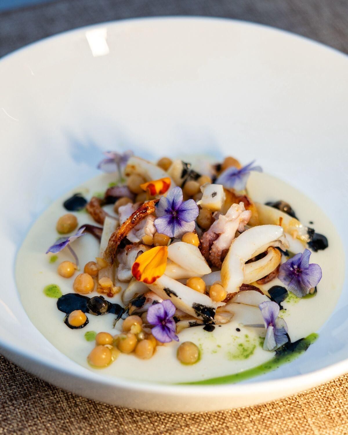 A bowl of food with various ingredients.