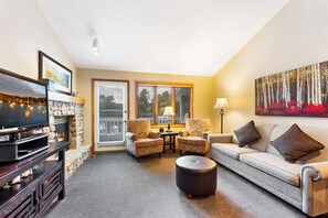 Premium Condo, 2 Bedrooms | Living area | 32-inch flat-screen TV with cable channels, TV, fireplace - Evergreen Hill Condominiums (Fish Creek)