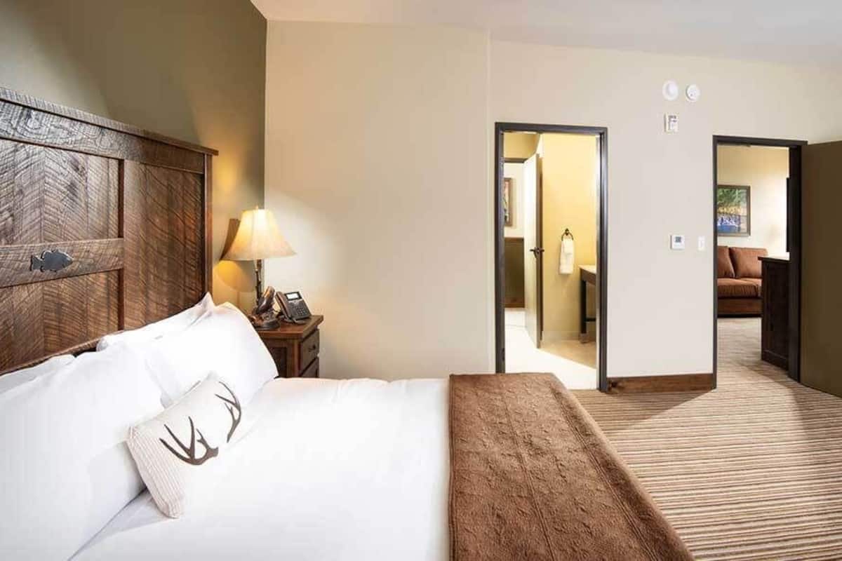 Premium bedding, desk, laptop workspace, iron/ironing board