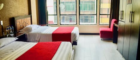 Family Triple Room | Blackout drapes, free WiFi, bed sheets