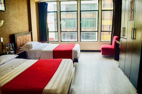 Family Triple Room | Blackout drapes, free WiFi, bed sheets