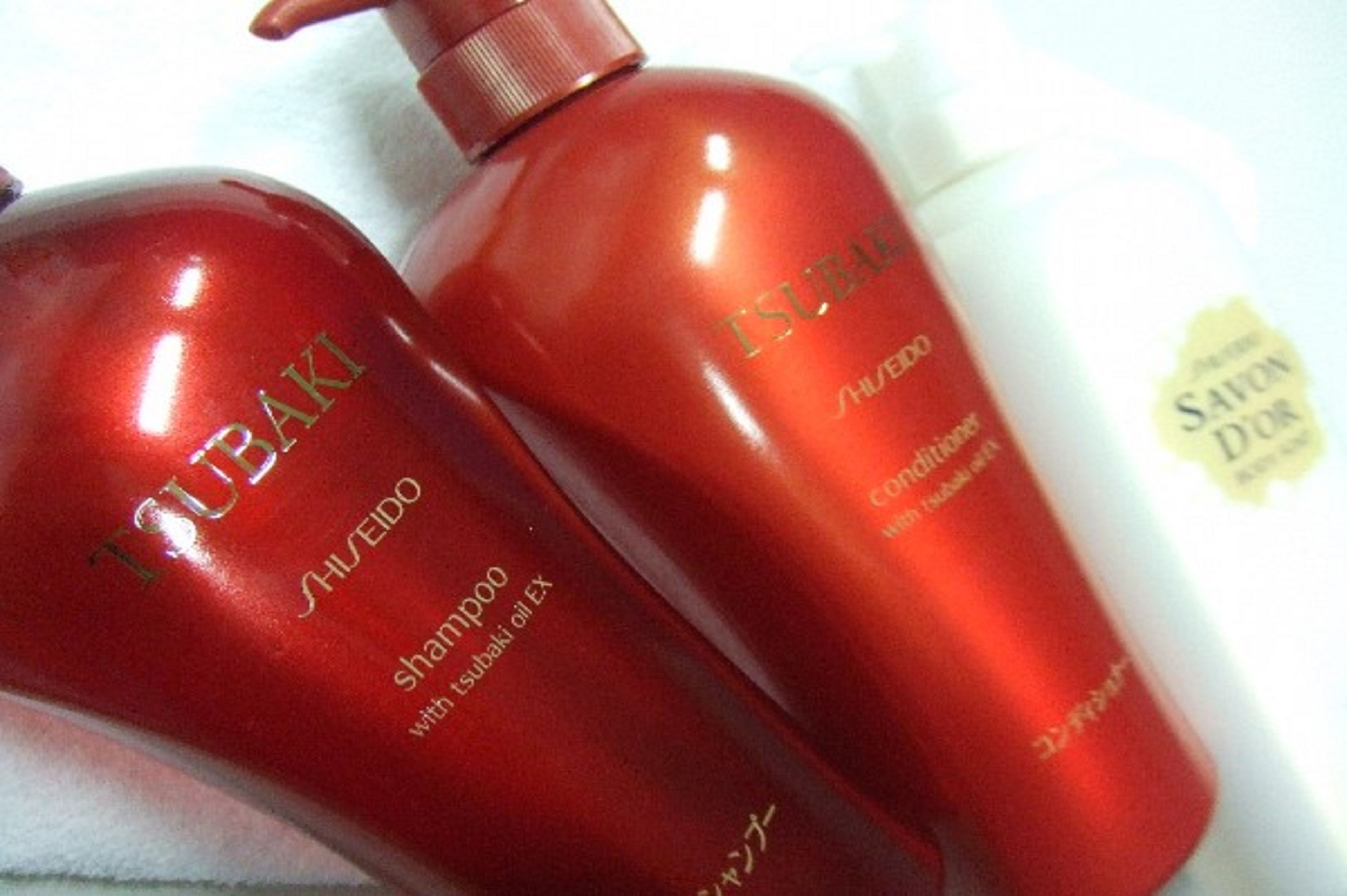 Two bottles of shampoo and conditioner.