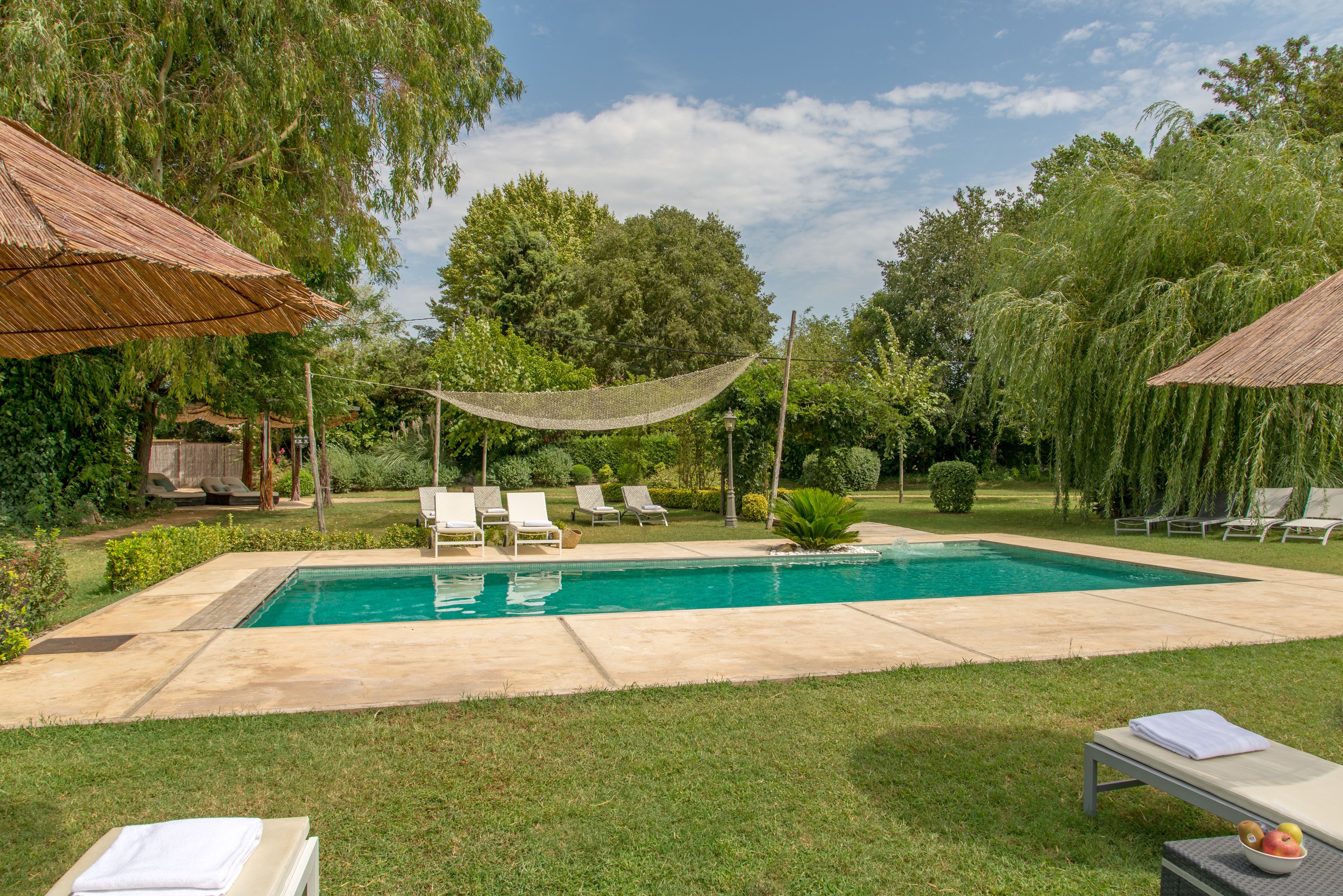 outdoor pool, pool umbrellas, pool loungers