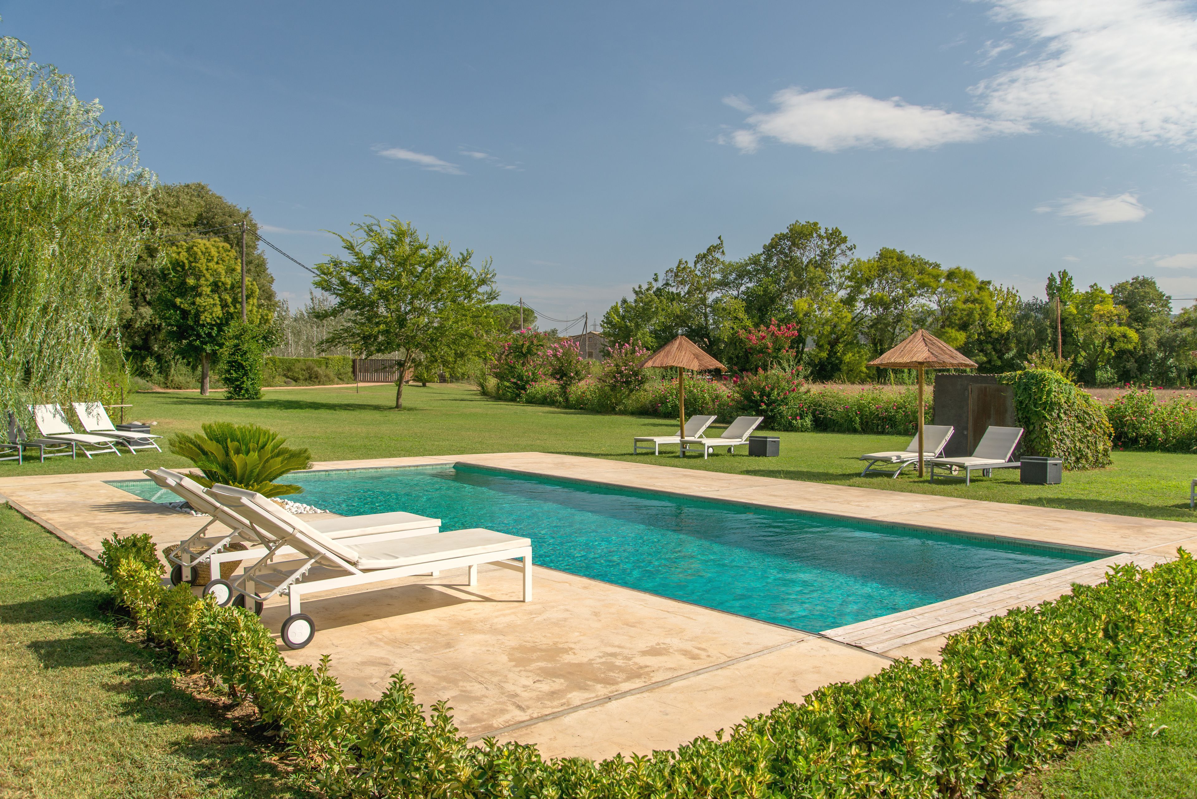 Outdoor pool, pool umbrellas, sun loungers