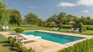 Outdoor pool, pool umbrellas, sun loungers