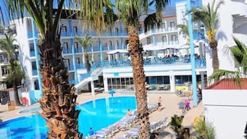 Seasonal outdoor pool, pool umbrellas, pool loungers