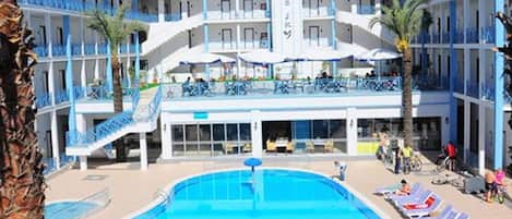 Seasonal outdoor pool, pool umbrellas, pool loungers