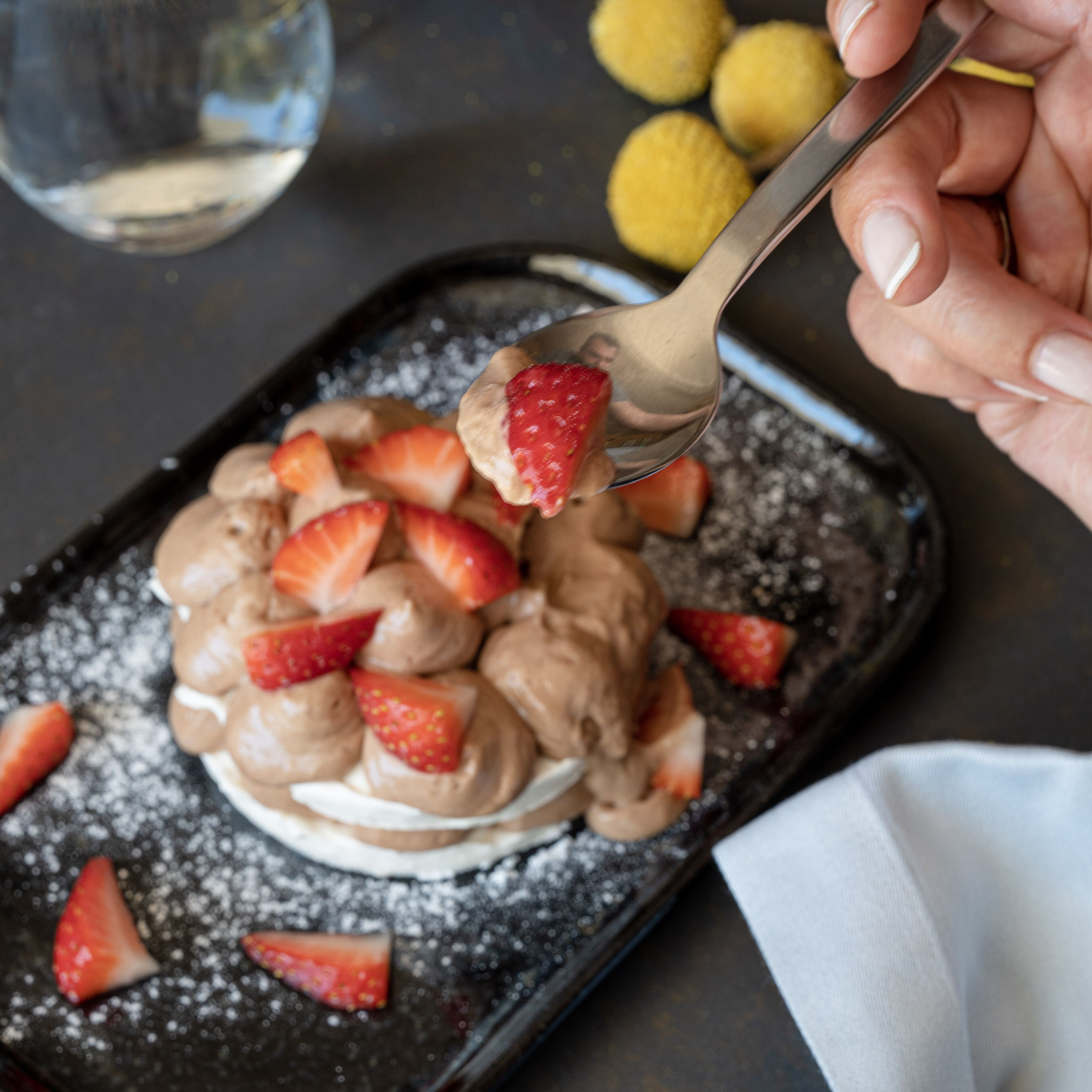 A dessert with strawberries on a plate.