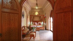 Deluxe Quadruple Room, Multiple Beds, Refrigerator, Pool View | Living area | Fireplace - Riad Jnane Jdid (Marrakech)