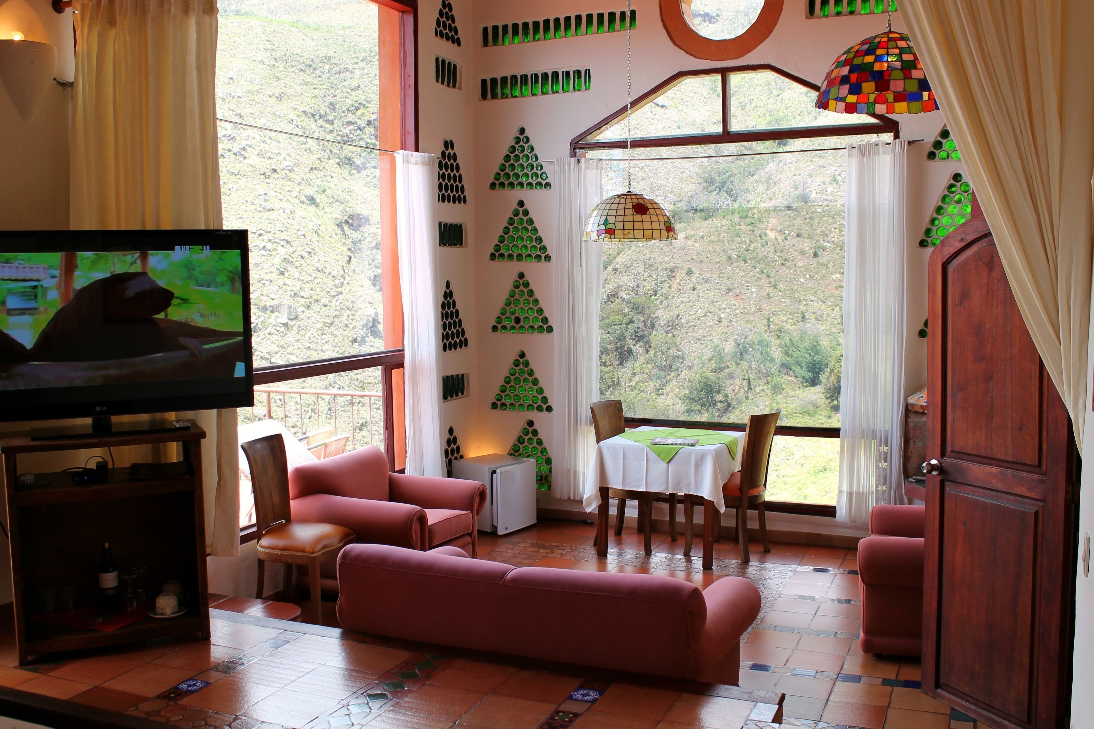 deluxe room | living room | 50-inch flat-screen tv with cable channels, tv