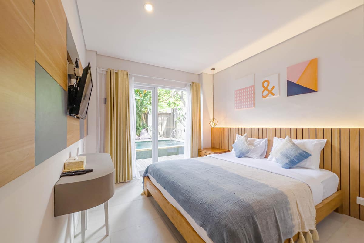 Deluxe Room, Pool Access | Minibar, in-room safe, desk, blackout drapes