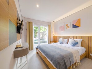 Deluxe Room, Pool Access | Minibar, in-room safe, desk, blackout drapes - Hola Seminyak (Seminyak)