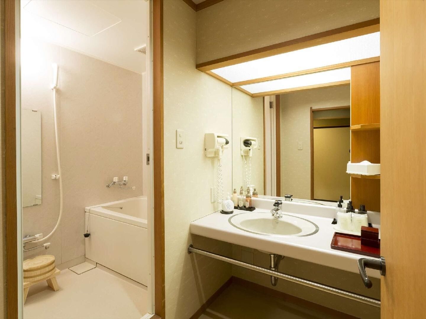 A bathroom with a bathtub, toilet, and sink.