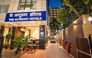 The Altruist Hotels with a modern facade, a welcoming entrance, and a paved pathway leading to the entrance. - The Altruist Andheri Hotel (Mumbai)
