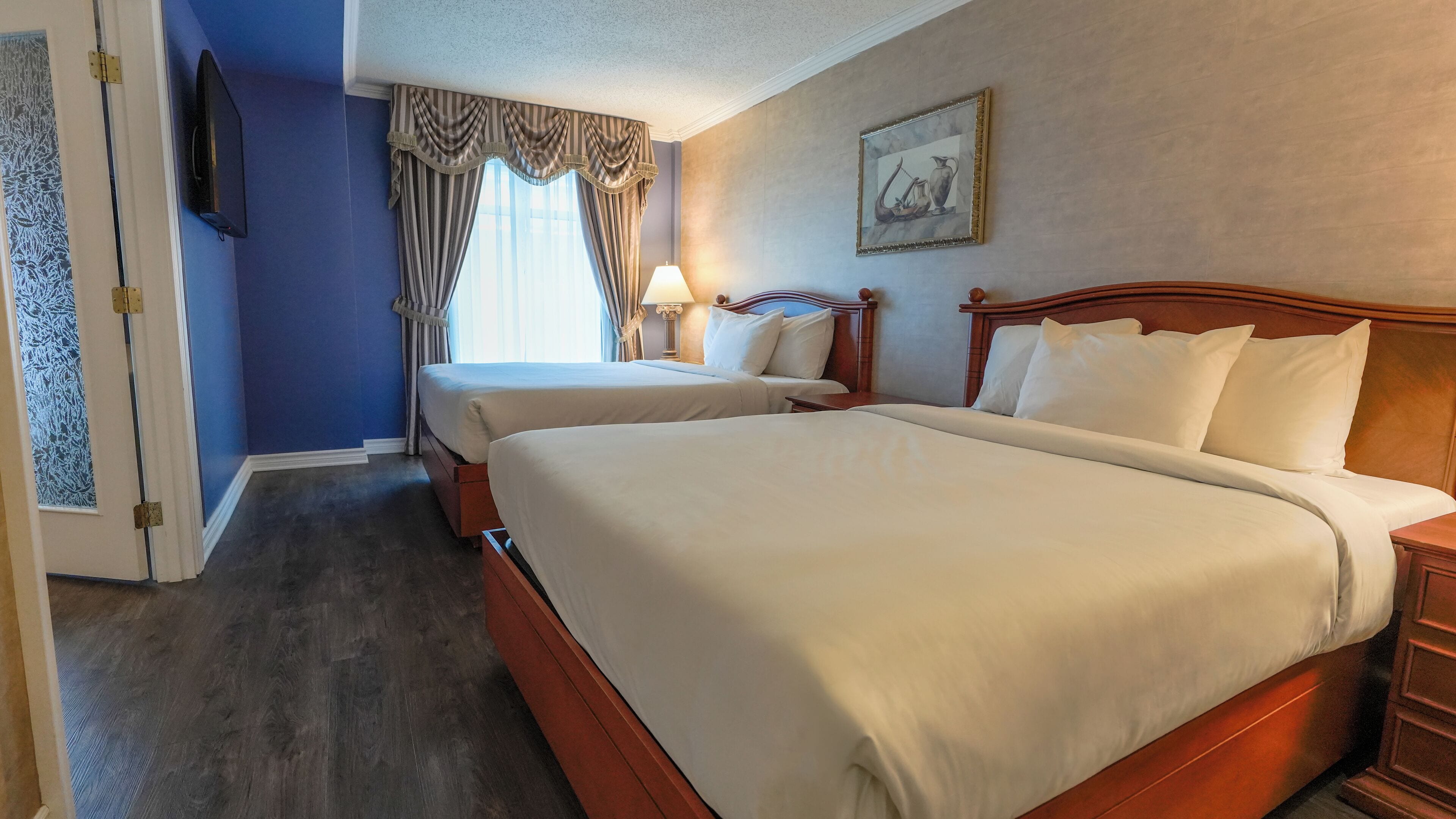 Exterior View Family Suite, 2 Queen and 1 sofa bed | Memory foam beds, in-room safe, desk, blackout drapes