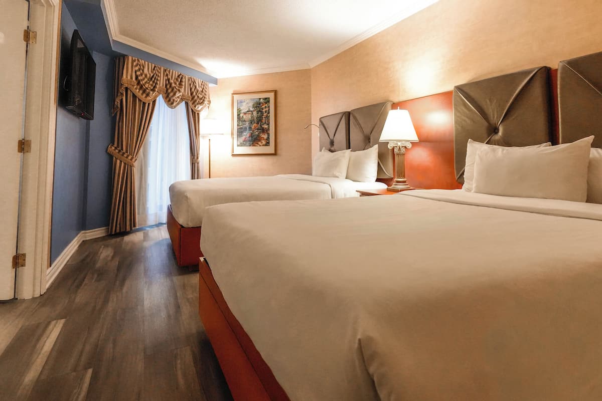 Interior Garden Balcony Family Suite, 2 Queen beds and Sofa-bed | Memory foam beds, in-room safe, desk, blackout drapes