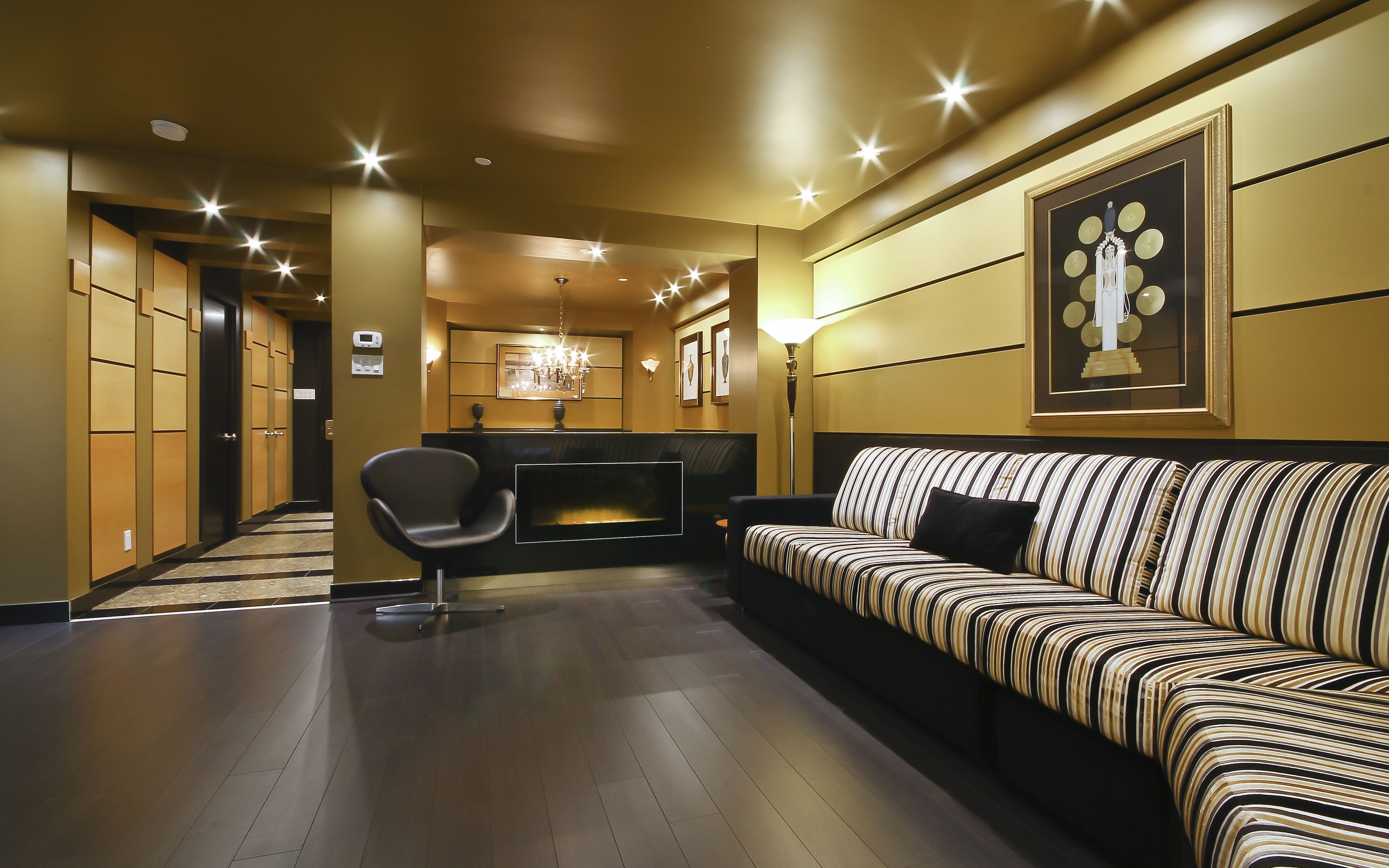 king bed suite with sofa bed - art deco theme | living area | 32-inch flat-screen tv with cable channels, tv, ipod dock