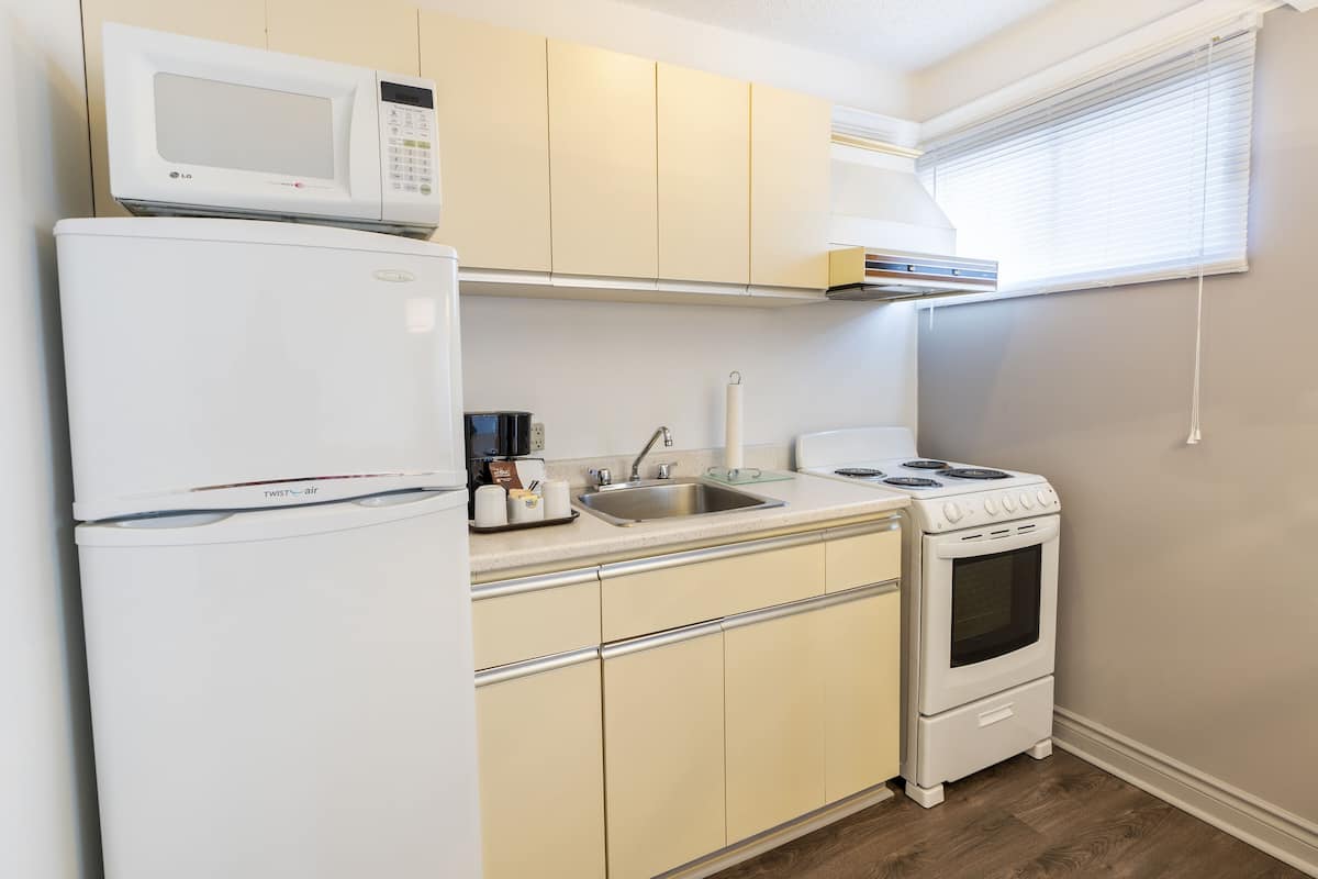 traditional room, 1 double murphy bed and 1 double sofa-bed with kitchenette - exterior view | private kitchenette | fridge, coffee/tea maker