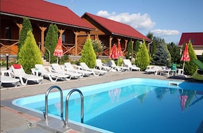 Seasonal outdoor pool, pool cabanas (surcharge), pool umbrellas