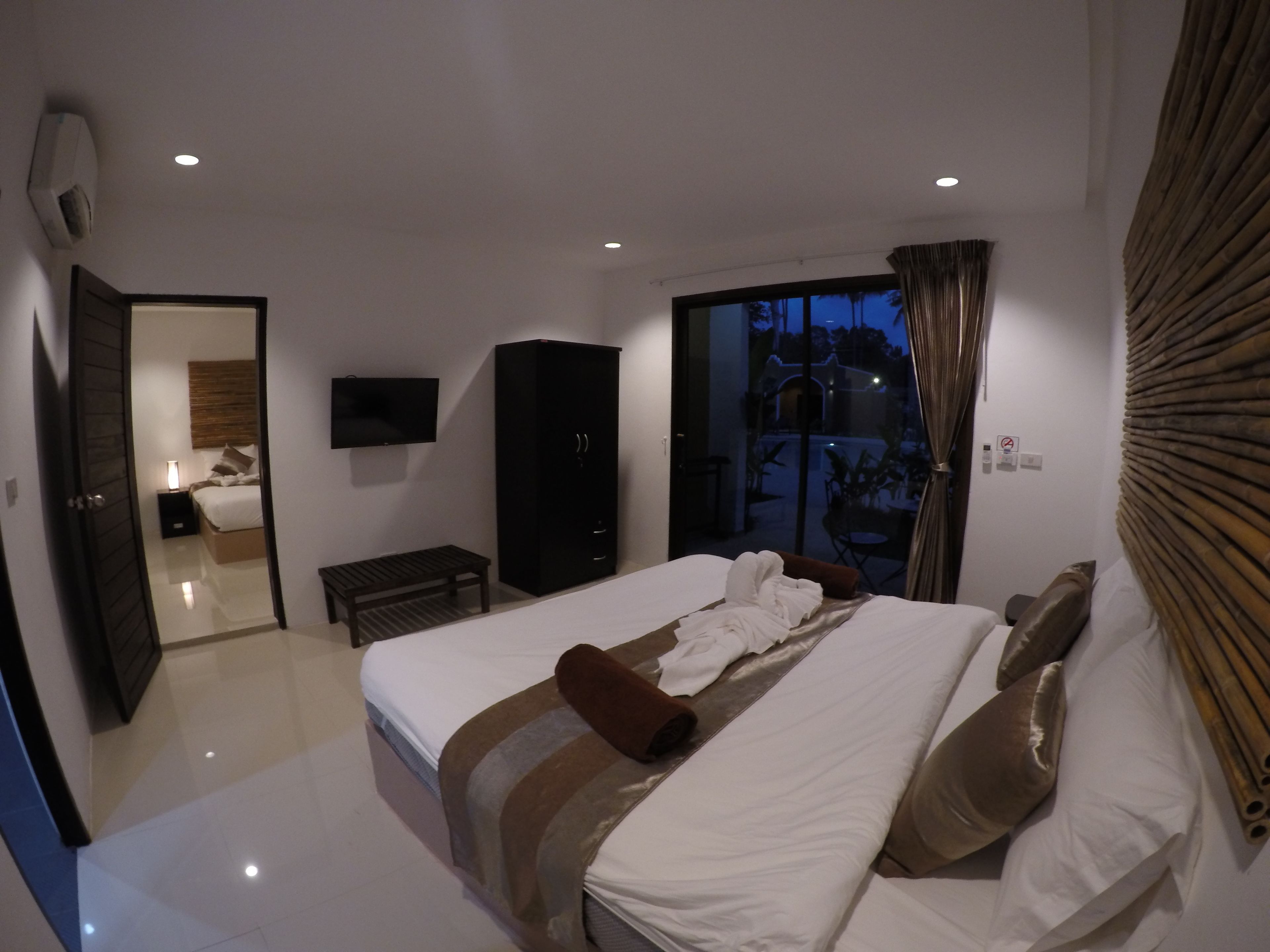deluxe room, 2 bedrooms, non smoking, pool view | minibar, in-room safe, blackout curtains, rollaway beds