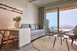 Deluxe Triple Suite with private pool and sea view | Living area | 45-inch flat-screen TV with digital channels -  Hotel Milos Sea Resort (Milos)