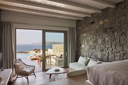Grand Suite with private pool and sea view | Living area | 45-inch flat-screen TV with digital channels