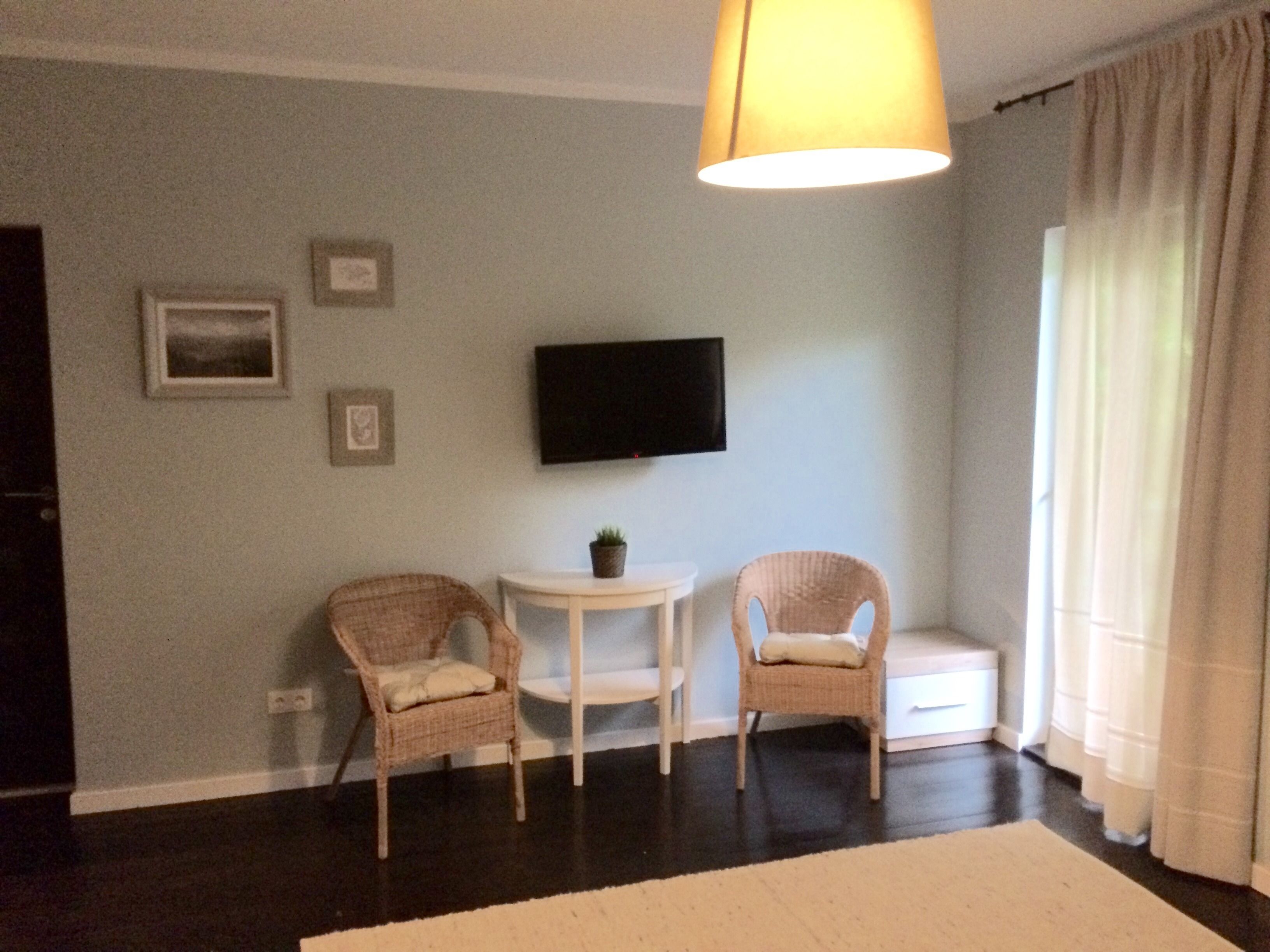 Family Triple Room, Mountain View | Living area | Flat-screen TV