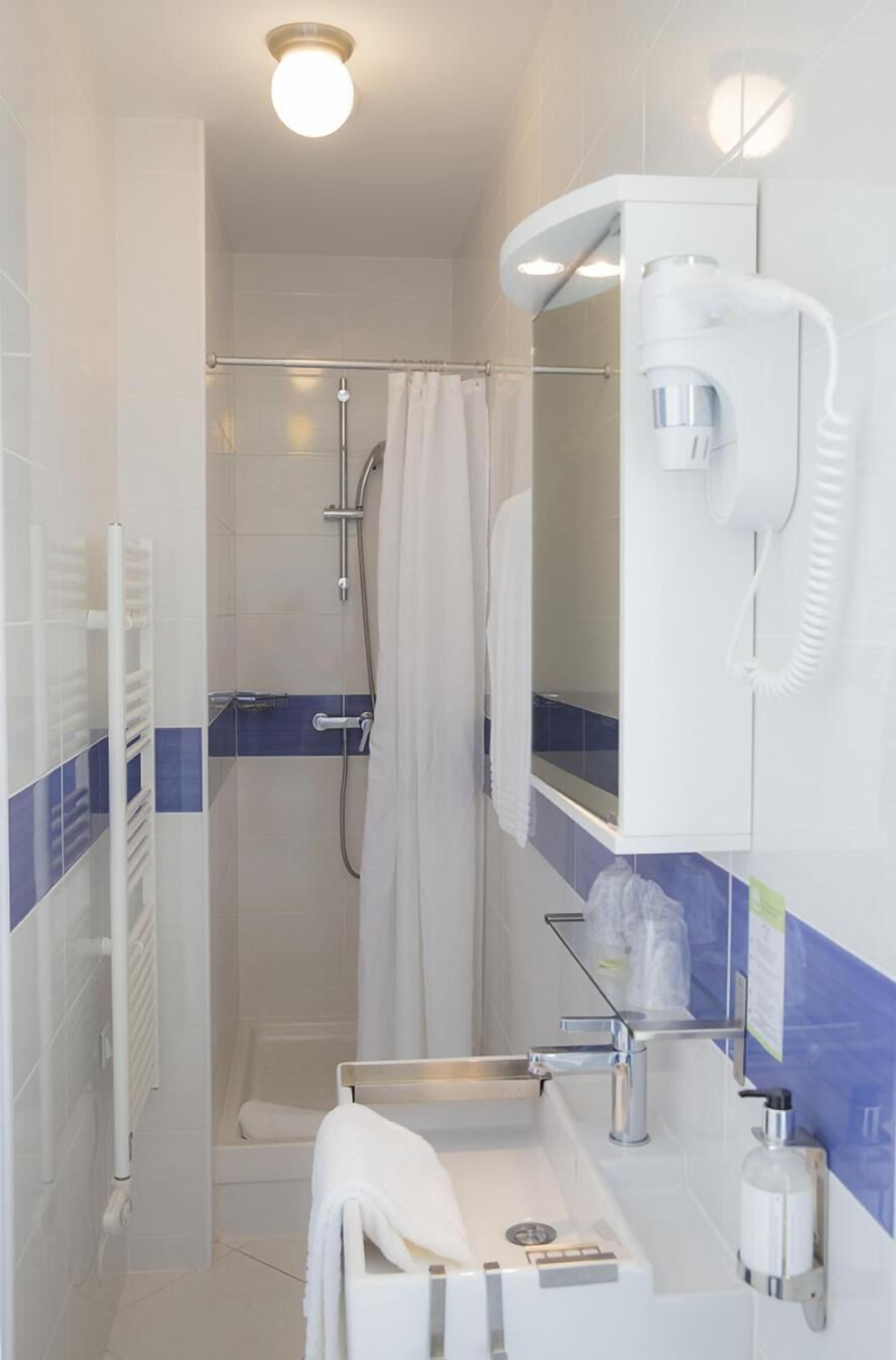 shower, free toiletries, hair dryer, towels