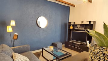 City Apartment | Living area | 25-inch flat-screen TV with digital channels, TV