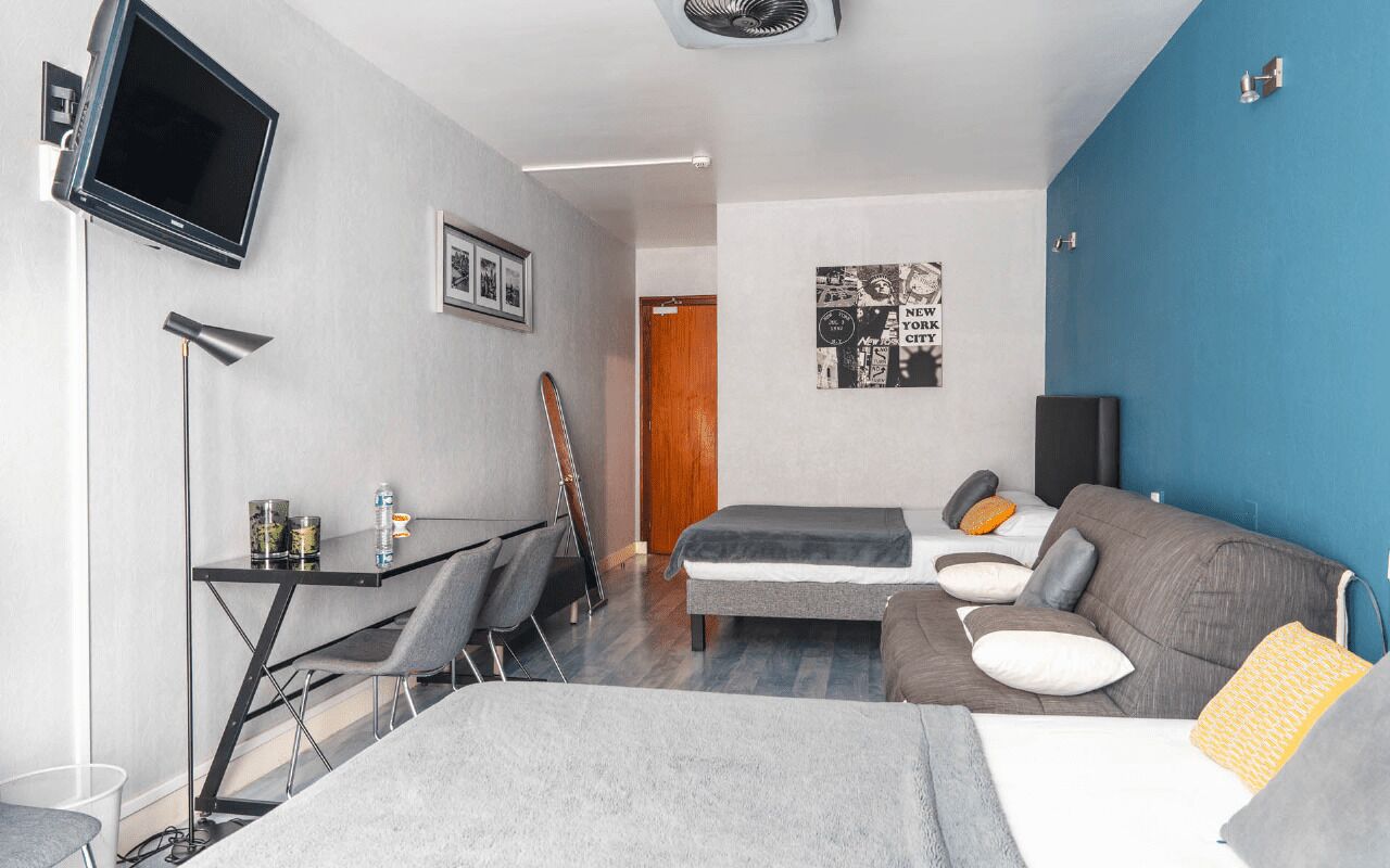 family room | premium bedding, select comfort beds, desk, soundproofing