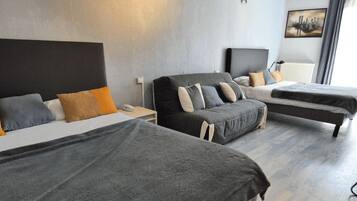 Family Room | Premium bedding, Select Comfort beds, desk, soundproofing