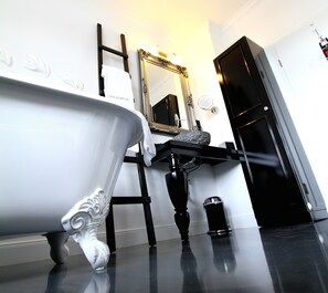 Designer toiletries, hair dryer, bathrobes